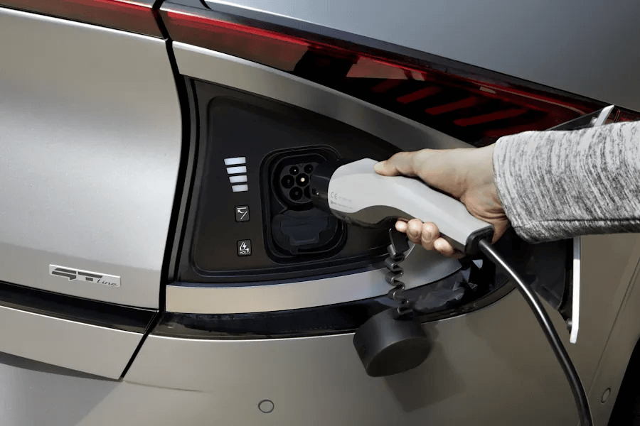 Powered charging flap