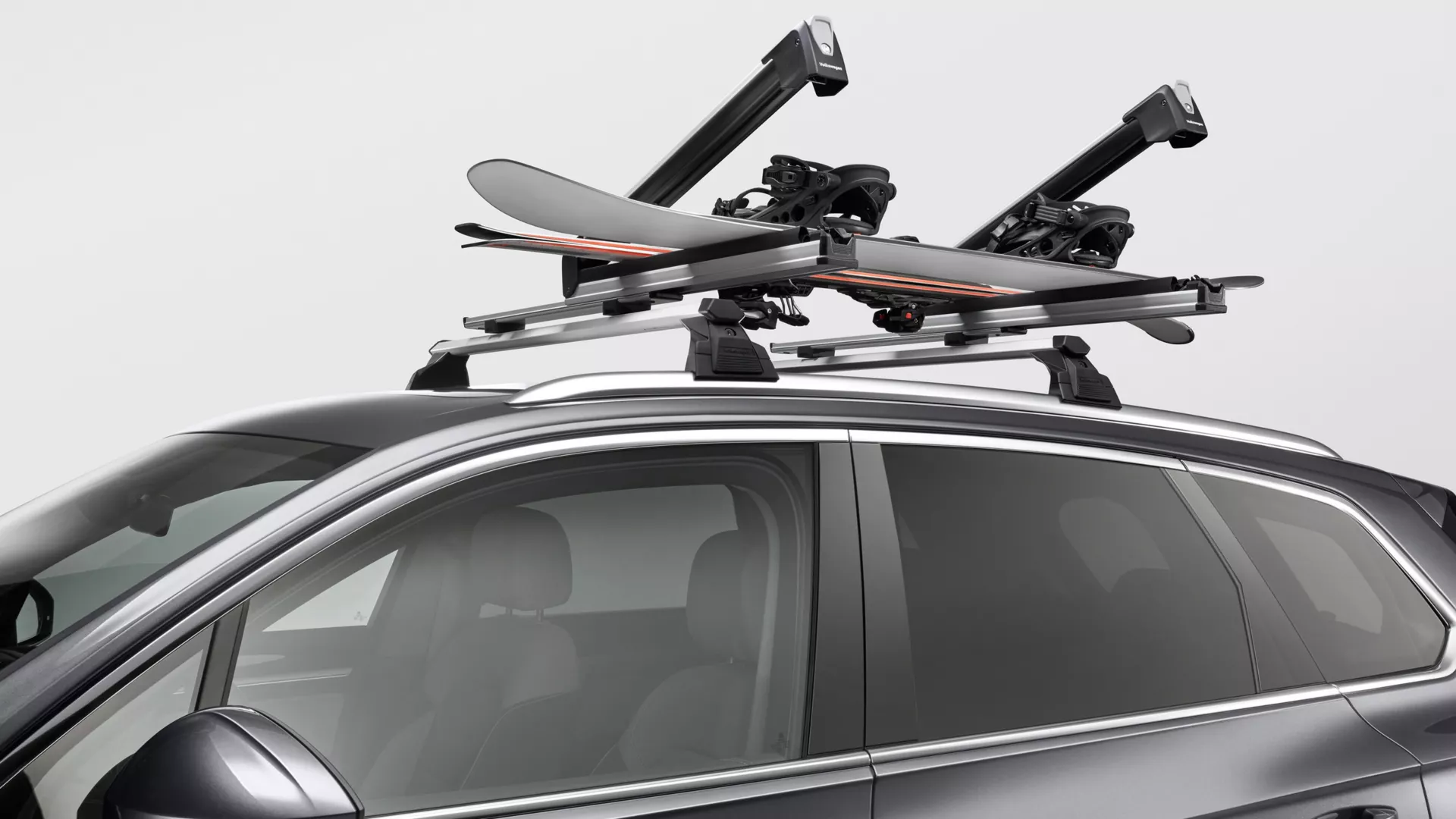 Ski and snowboard carrier