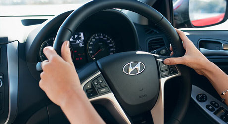 Accent  Premium steering wheel with mounted controls.