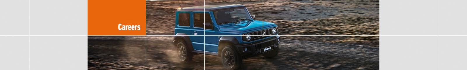 Suzuki Jimny driving on sand