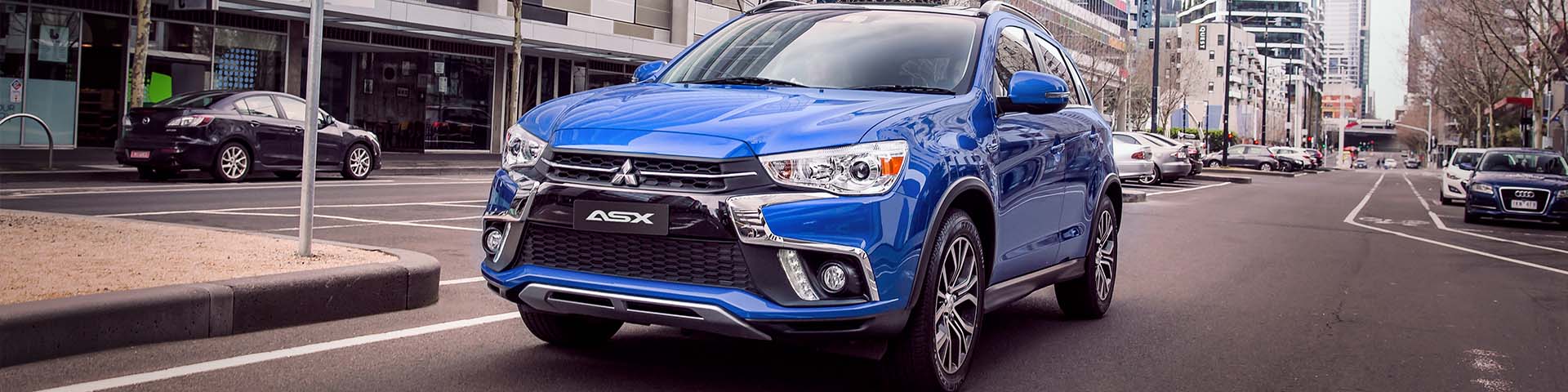 Mitsubishi ASX in white.