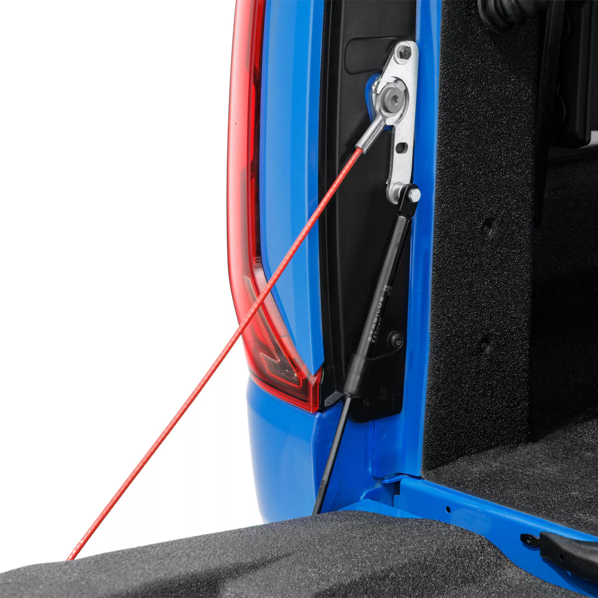 Self-lowering tailgate assist