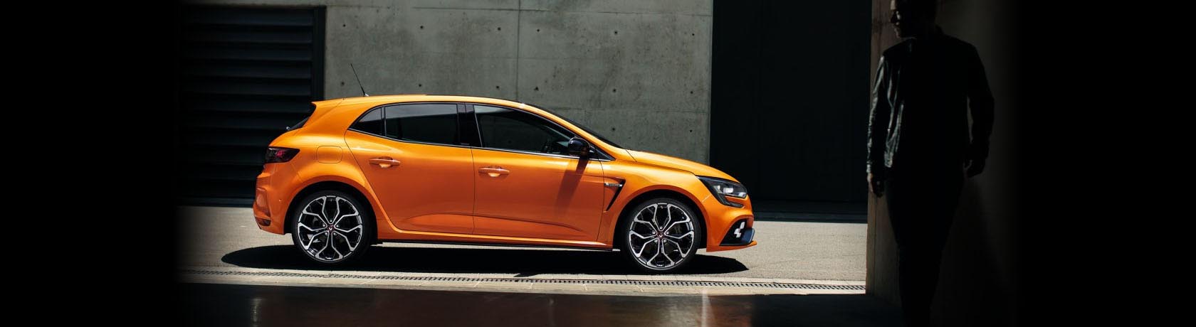 Renault Megane R.S in liquid yellow in a simulated racing pit stop.
