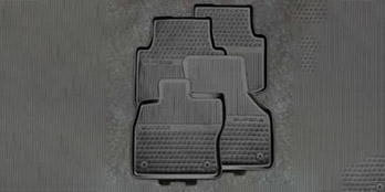 Rubber floor mats with raised trim