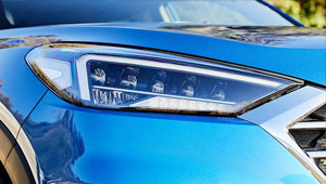 Tucson Restyled headlamps and daytime running lamps.